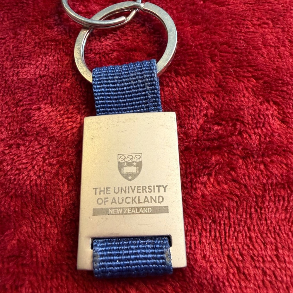 University of Auckland New Zealand Keychain Blue Nylon Silver Tone Metal Crest